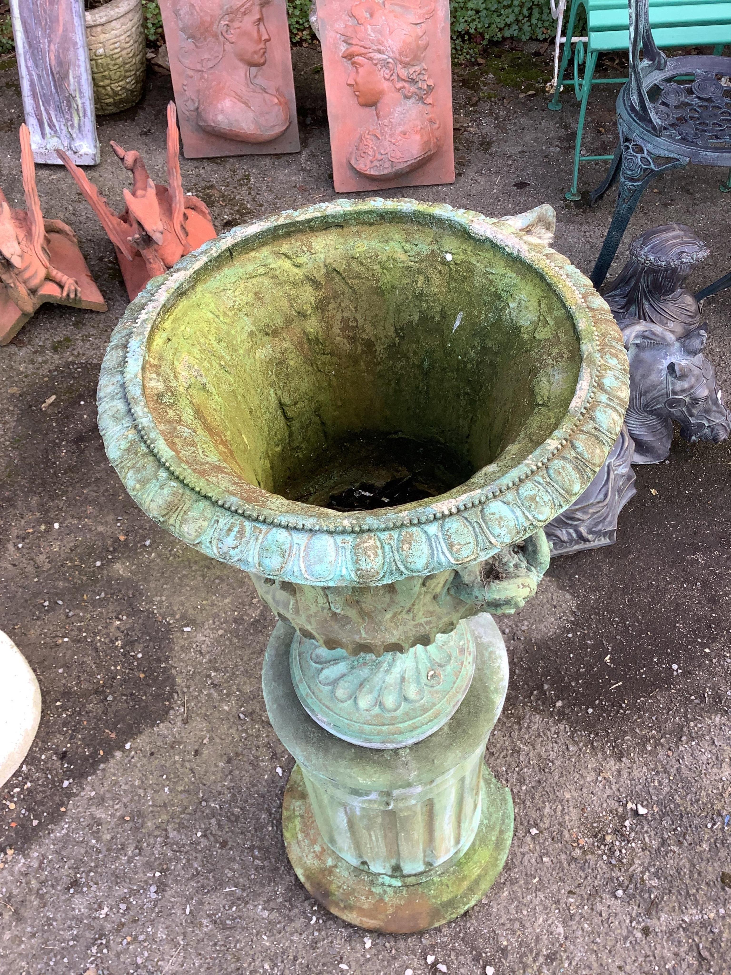 A cast composition campana garden urn on fluted pedestal, height 94cm. Condition - fair